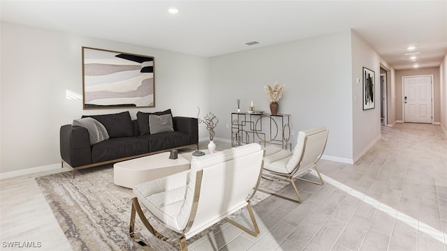 living room with light hardwood / wood-style flooring