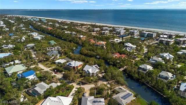 aerial view featuring a water view and a view of the beach