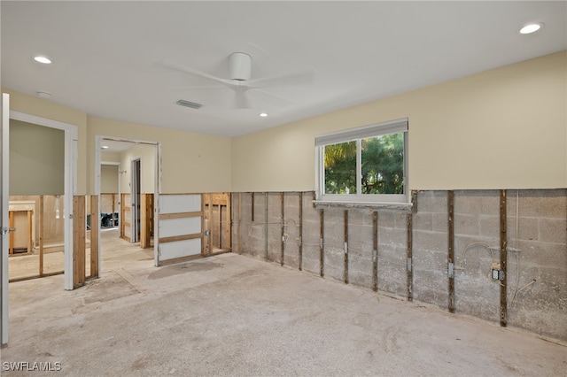 interior space with ceiling fan