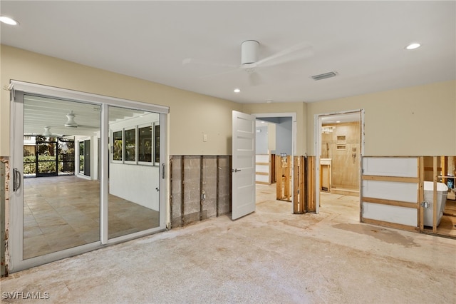 carpeted spare room with ceiling fan