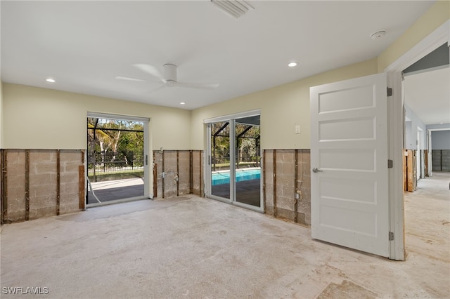 unfurnished living room featuring ceiling fan