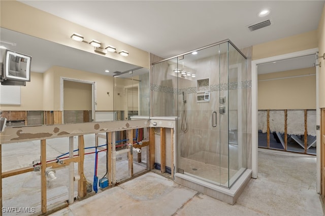 bathroom featuring concrete flooring and walk in shower