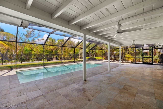 view of pool featuring a patio area, ceiling fan, and glass enclosure