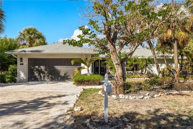 view of front of property with a garage