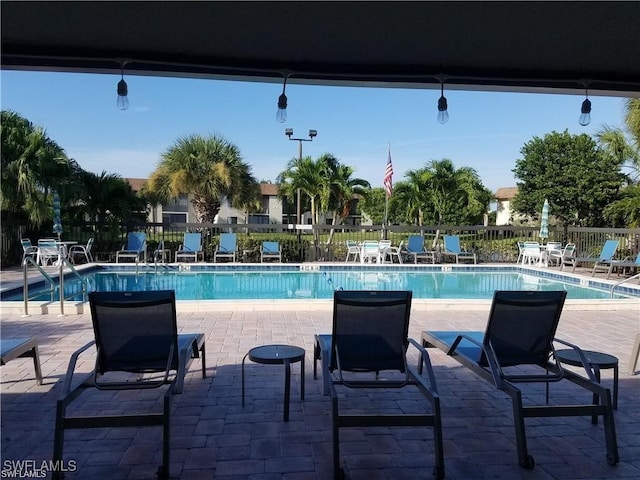 view of swimming pool featuring a patio area