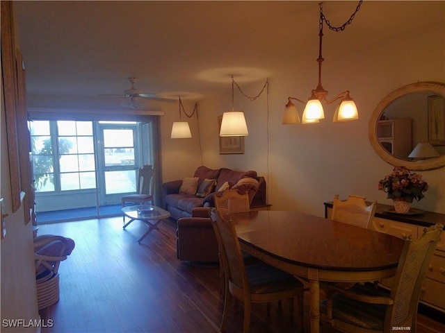 dining room with a ceiling fan and wood finished floors