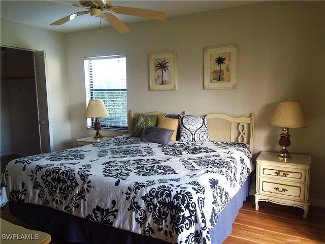 bedroom with light hardwood / wood-style flooring and ceiling fan