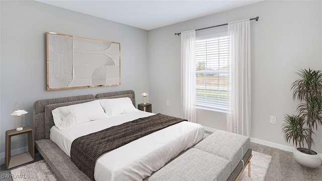 bedroom with carpet flooring and baseboards
