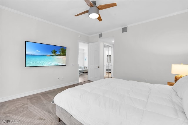 carpeted bedroom with ceiling fan and ornamental molding