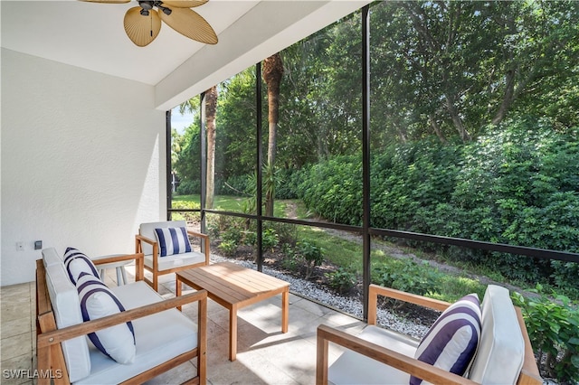 sunroom / solarium featuring ceiling fan