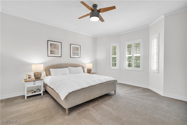 carpeted bedroom featuring ceiling fan and crown molding