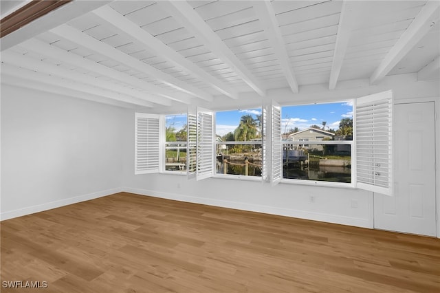 interior space with beam ceiling and wooden ceiling