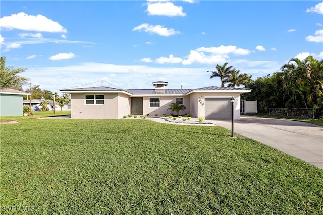 ranch-style house featuring a front yard and a garage