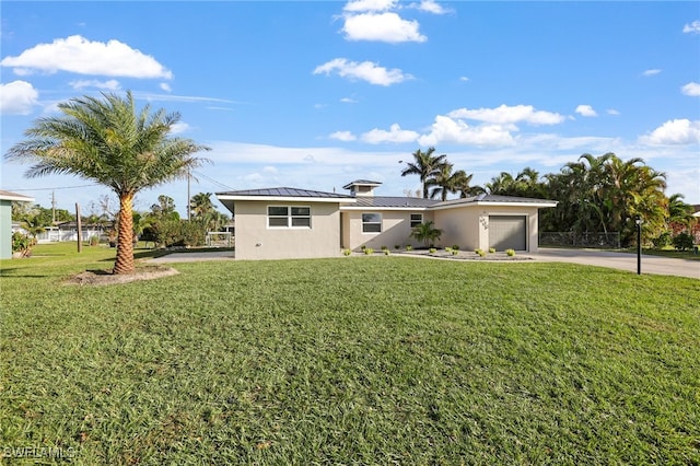 ranch-style home with a front lawn and a garage