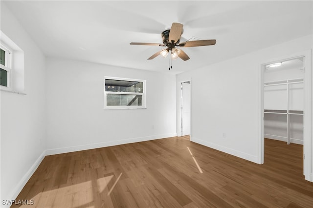 unfurnished room with wood-type flooring and ceiling fan