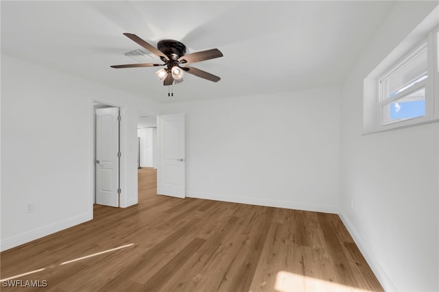 unfurnished bedroom featuring hardwood / wood-style flooring and ceiling fan