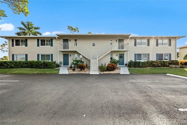 view of front of home with a balcony