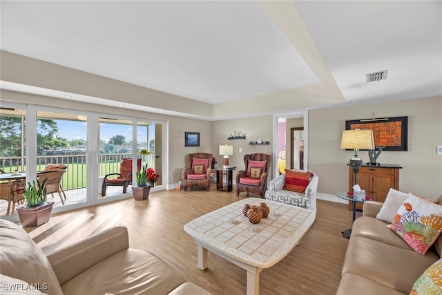 living room featuring french doors and hardwood / wood-style floors