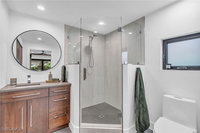 bathroom with vanity, toilet, and an enclosed shower