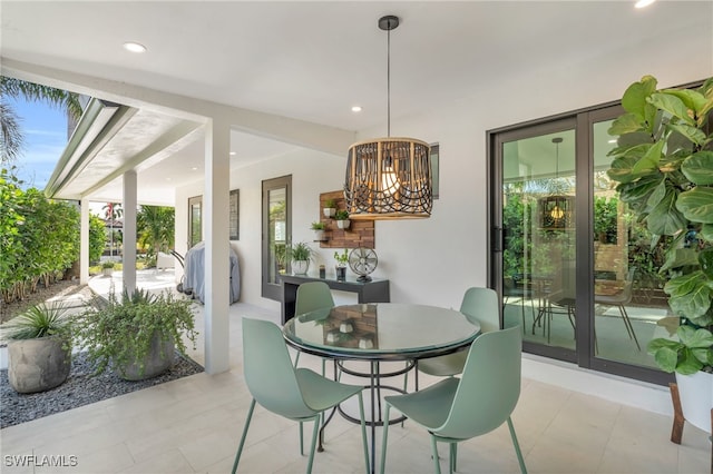 dining space featuring a healthy amount of sunlight and a chandelier