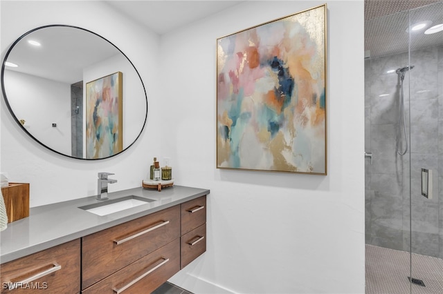 bathroom with vanity and an enclosed shower