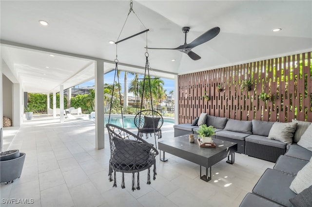 view of patio with outdoor lounge area and ceiling fan