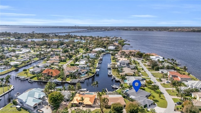 birds eye view of property featuring a water view