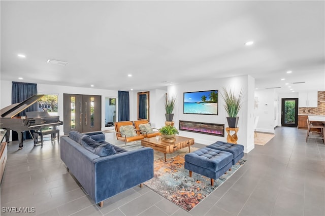 living room featuring light tile patterned flooring