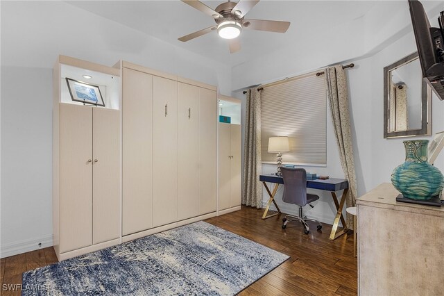 office area with dark hardwood / wood-style floors and ceiling fan