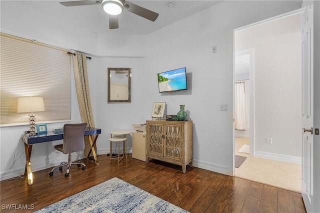 office space featuring dark wood-type flooring and ceiling fan