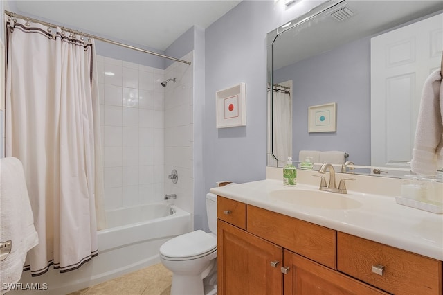 full bathroom with vanity, shower / bath combo with shower curtain, toilet, and tile patterned floors