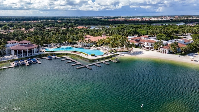 birds eye view of property with a water view