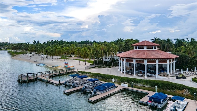 view of dock with a gazebo and a water view