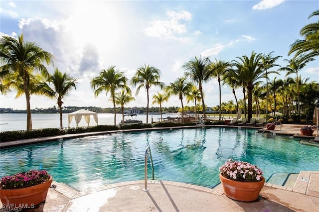 view of pool with a water view