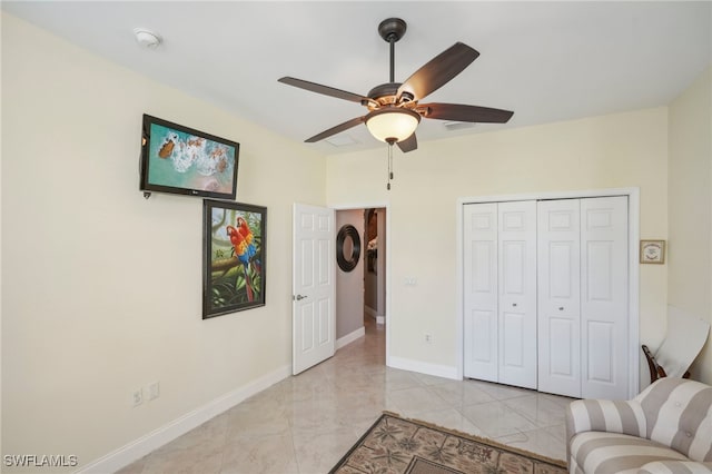 interior space featuring ceiling fan