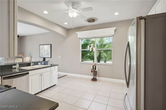 kitchen featuring sink, ceiling fan, light tile patterned floors, white cabinetry, and stainless steel appliances