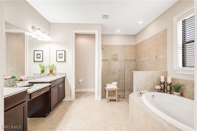 bathroom with vanity, tile patterned floors, and independent shower and bath