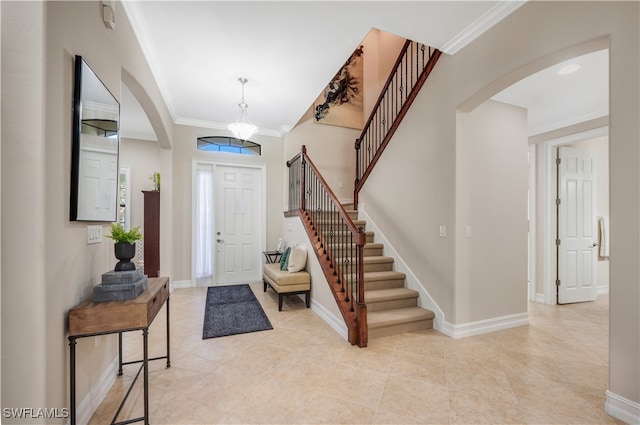 tiled entrance foyer with ornamental molding