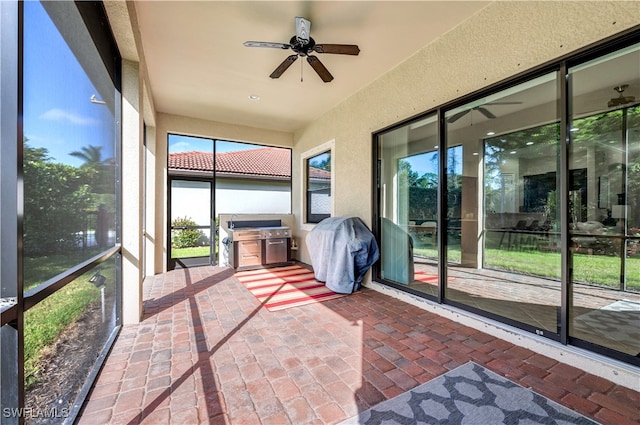 sunroom / solarium with ceiling fan