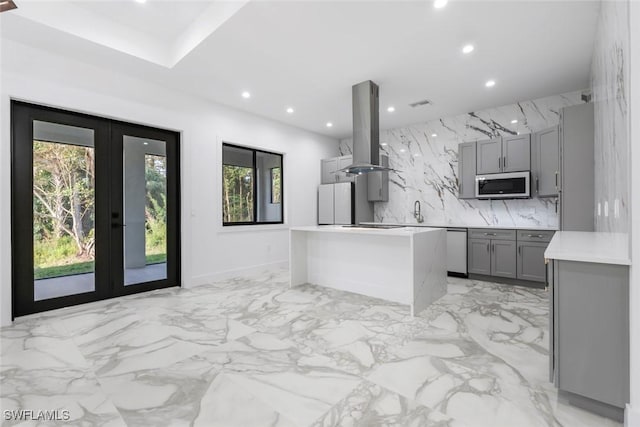 3421 16th Ave NE, Naples, FL 34120 - kitchen with recessed lighting, gray cabinets, a wealth of natural light, and island range hood