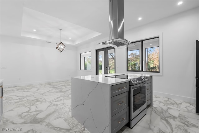 kitchen featuring stainless steel range with electric cooktop, a kitchen island, light stone countertops, island range hood, and pendant lighting