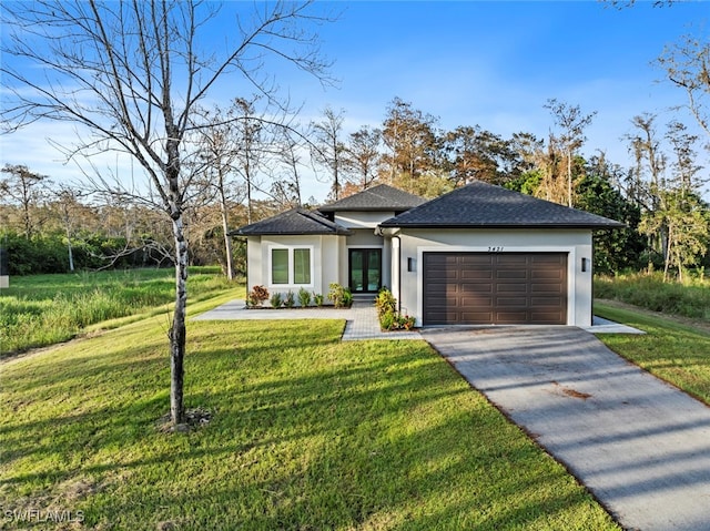 view of front facade with a garage and a front lawn