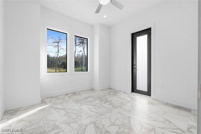 3421 16th Ave NE, Naples, FL 34120 - empty room featuring baseboards, recessed lighting, marble finish floor, and ceiling fan