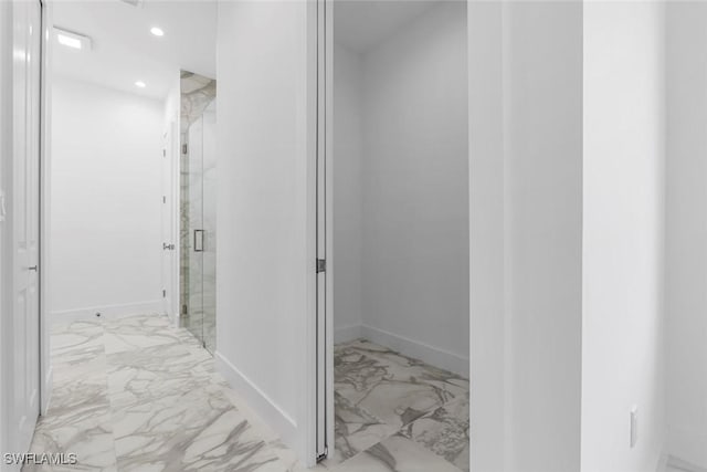 3421 16th Ave NE, Naples, FL 34120 - bathroom featuring baseboards, recessed lighting, marble finish floor, and a stall shower