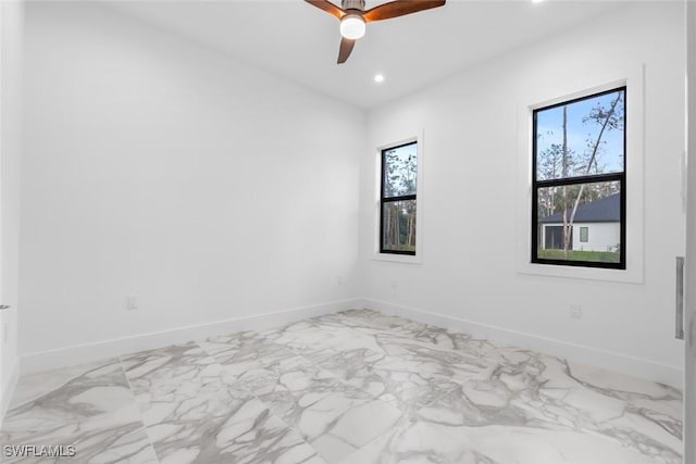 3421 16th Ave NE, Naples, FL 34120 - spare room featuring recessed lighting, baseboards, ceiling fan, and marble finish floor
