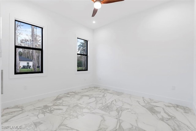 3421 16th Ave NE, Naples, FL 34120 - spare room featuring recessed lighting, baseboards, ceiling fan, and marble finish floor