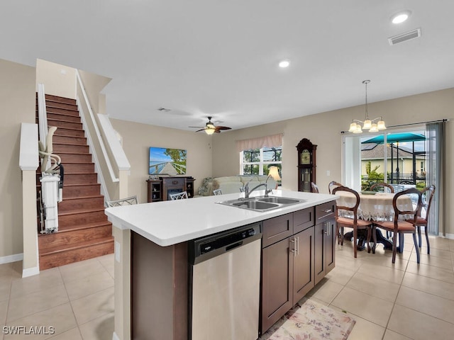 2739 Merida Ln, Cape Coral, FL 33909 - kitchen featuring hanging light fixtures, a sink, a kitchen island with sink, dishwasher, and light countertops