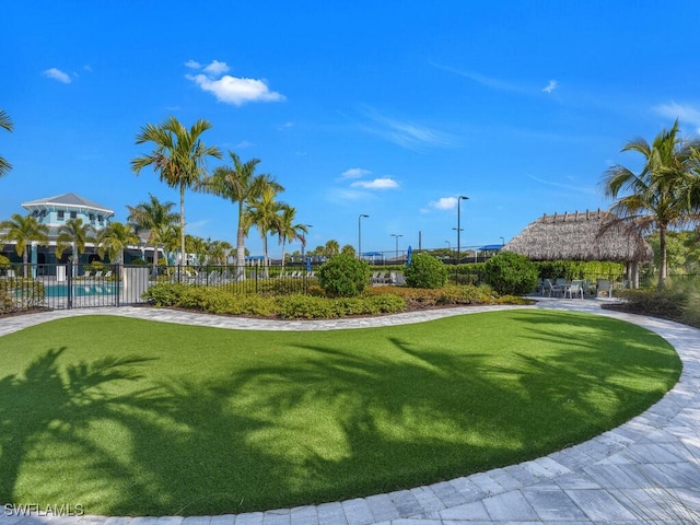 2739 Merida Ln, Cape Coral, FL 33909 - view of property's community with a gazebo, a yard, a swimming pool, and fence