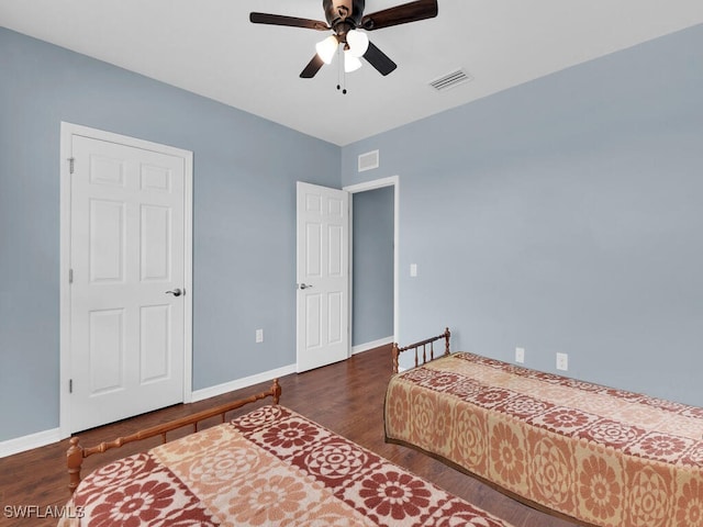 2739 Merida Ln, Cape Coral, FL 33909 - bedroom with baseboards, wood finished floors, visible vents, and a ceiling fan
