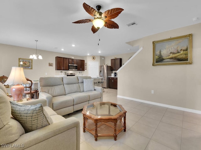 2739 Merida Ln, Cape Coral, FL 33909 - living room featuring ceiling fan with notable chandelier, visible vents, recessed lighting, and light tile patterned floors